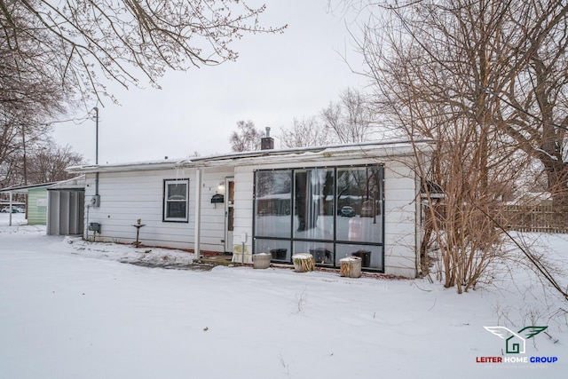 view of snow covered house