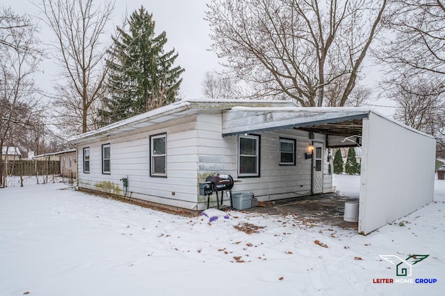 exterior space with a carport