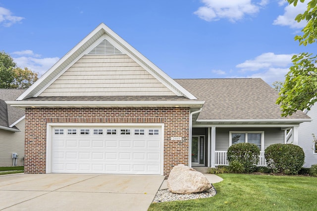 view of front facade featuring a garage, covered porch, and a front lawn