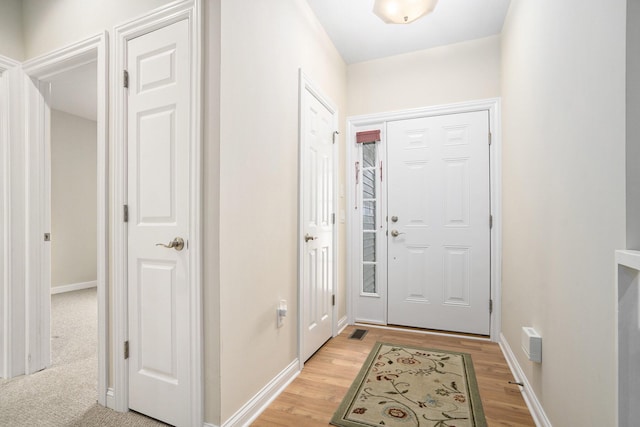 foyer entrance with light wood-type flooring