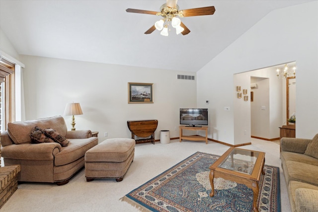 living room featuring ceiling fan with notable chandelier, carpet, and lofted ceiling