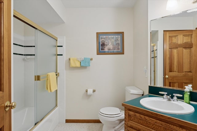 full bathroom featuring vanity, toilet, and shower / bath combination with glass door