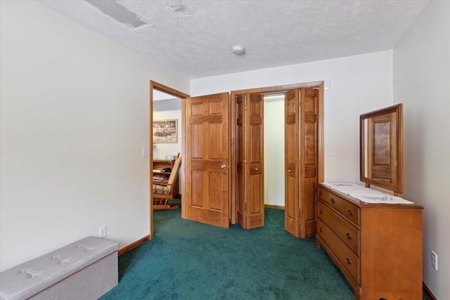 carpeted bedroom featuring a textured ceiling