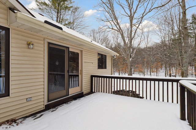 view of snow covered deck