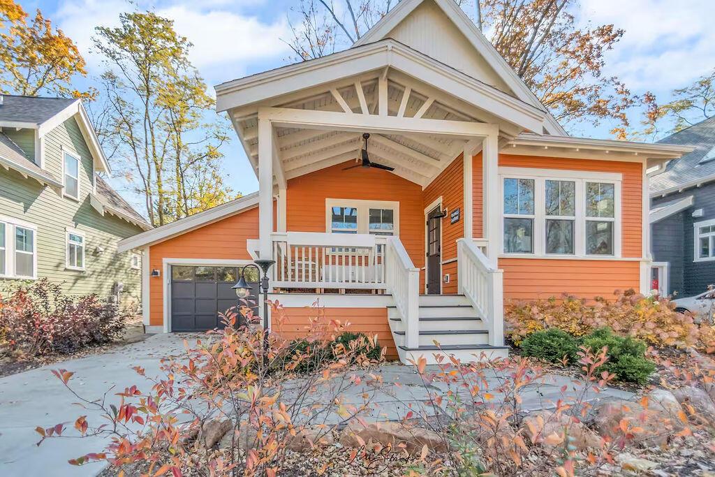 view of front facade with a garage and a porch