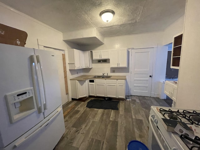 kitchen with white appliances, dark wood-type flooring, sink, a textured ceiling, and white cabinetry