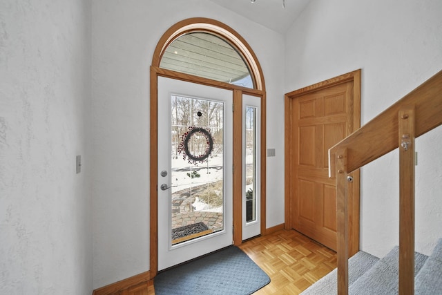 entryway with light parquet floors