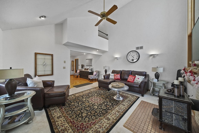 living room with carpet, high vaulted ceiling, and ceiling fan