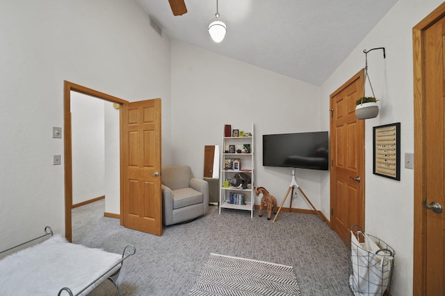 interior space with ceiling fan and lofted ceiling