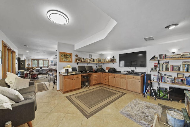 kitchen featuring kitchen peninsula and light tile patterned floors