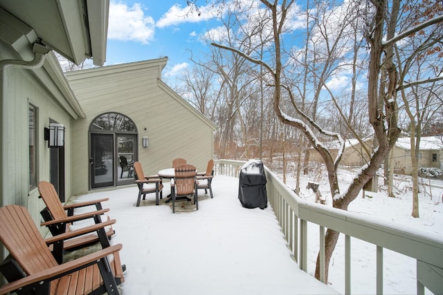 view of snow covered deck