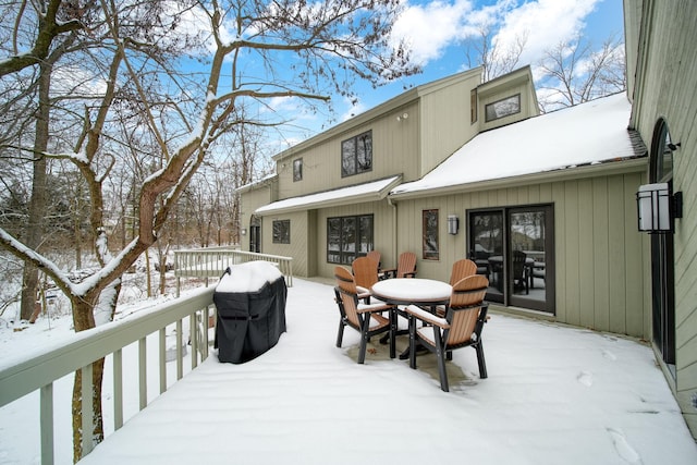 view of snow covered deck