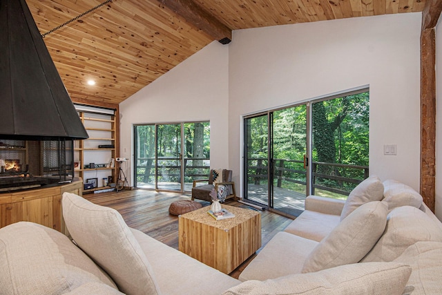 living room featuring beam ceiling, wood-type flooring, high vaulted ceiling, and wooden ceiling