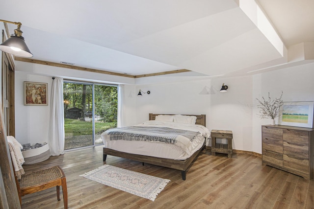 bedroom featuring access to outside and light hardwood / wood-style flooring