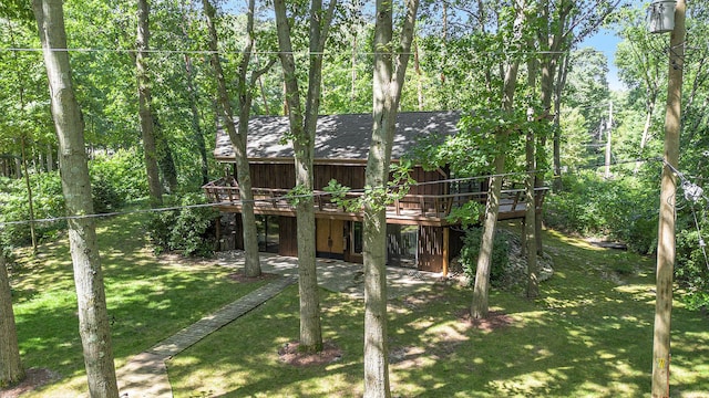 view of playground with a yard and a deck