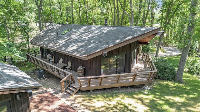 wooden deck featuring a yard