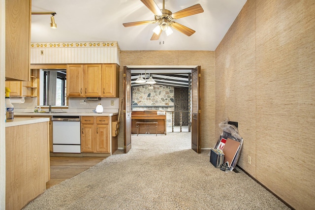 kitchen featuring white dishwasher, sink, light carpet, and ceiling fan