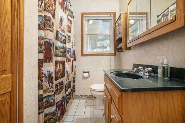 bathroom featuring toilet, a shower with curtain, tile patterned floors, and vanity