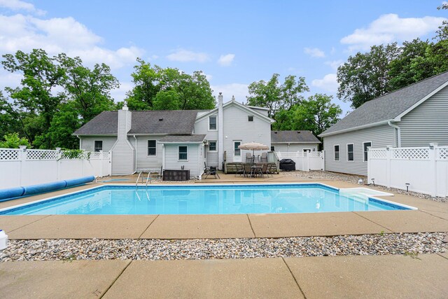 view of swimming pool with a patio