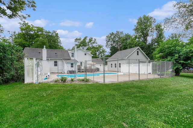 view of swimming pool with a lawn and a patio