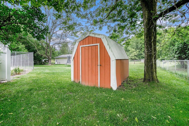 view of outdoor structure with a yard