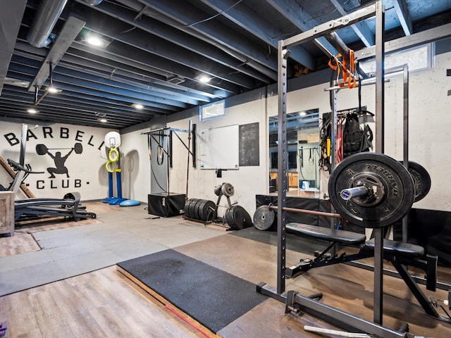 workout area featuring plenty of natural light and wood-type flooring