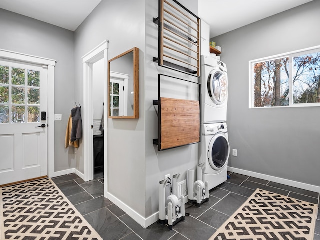 laundry area featuring stacked washer and clothes dryer