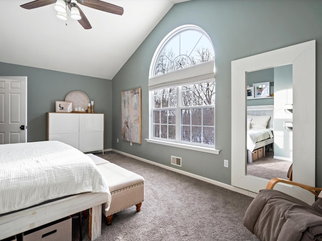 carpeted bedroom with vaulted ceiling and ceiling fan