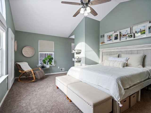 carpeted bedroom featuring lofted ceiling and ceiling fan