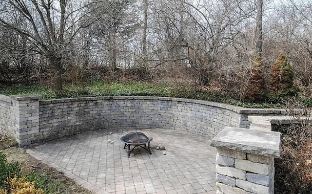 view of patio featuring a fire pit