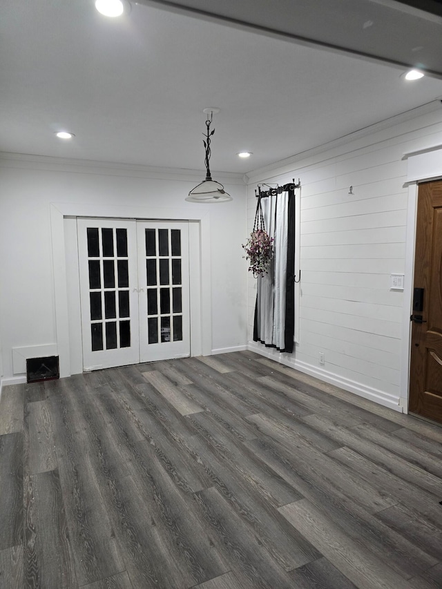 spare room featuring dark hardwood / wood-style floors and ornamental molding