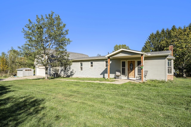 ranch-style house with a front yard and a garage