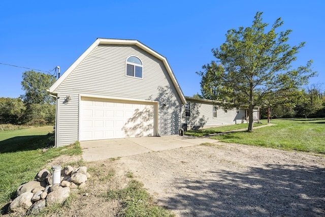 view of property exterior featuring a lawn and a garage