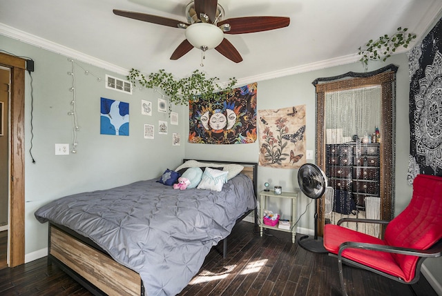 bedroom featuring hardwood / wood-style floors, ceiling fan, and crown molding