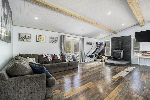 living room featuring dark wood-type flooring, wooden ceiling, a wood stove, and vaulted ceiling with beams