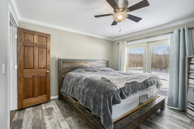 bedroom featuring ornamental molding, ceiling fan, and wood-type flooring