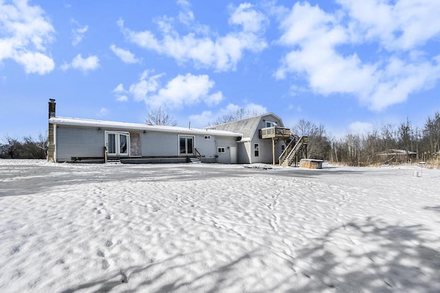 view of snow covered property