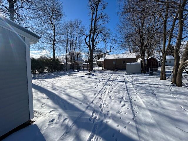 view of yard covered in snow