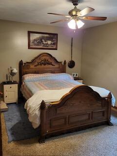 bedroom with ceiling fan and carpet