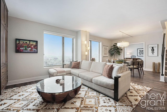 living room with dark hardwood / wood-style flooring