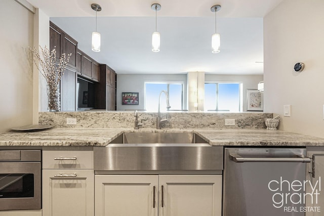 kitchen featuring sink, stainless steel dishwasher, wall oven, dark brown cabinets, and light stone counters