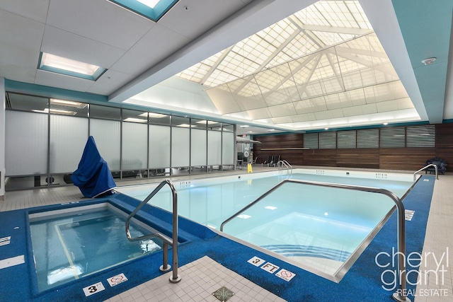 view of pool featuring a skylight