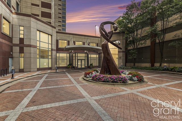 view of exterior entry at dusk