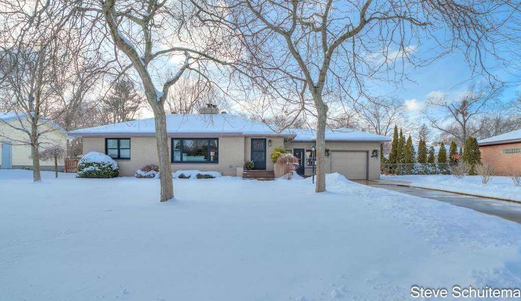 single story home featuring a garage