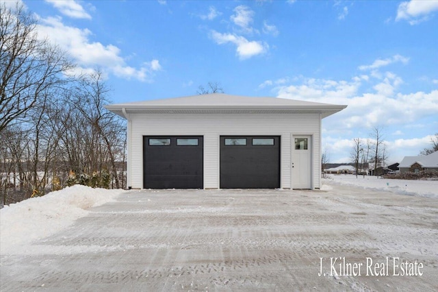 view of snow covered garage