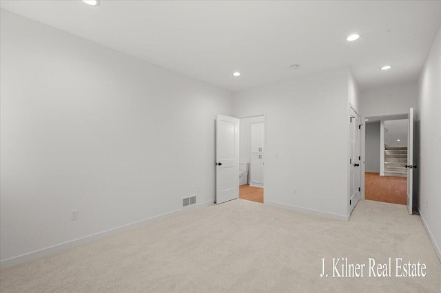 unfurnished bedroom with light carpet