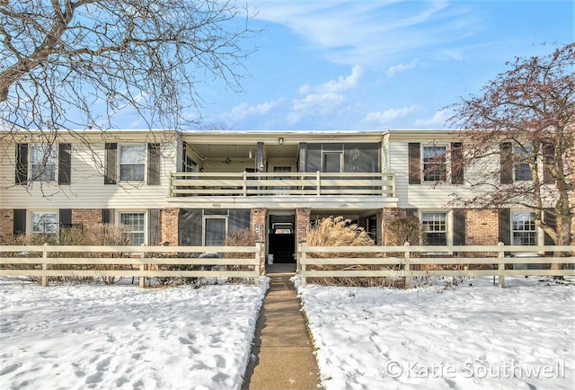 view of front of home with a balcony