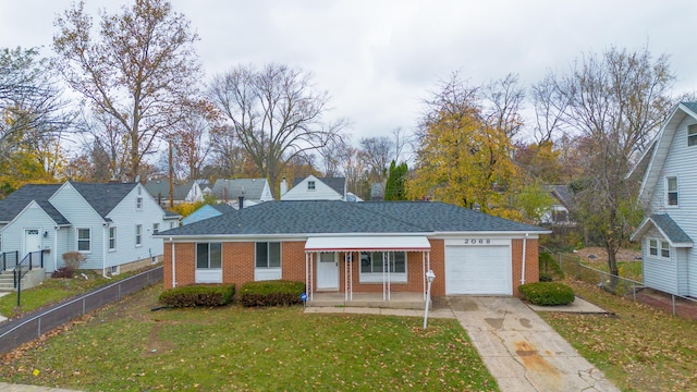 view of front of house featuring a front yard and a garage