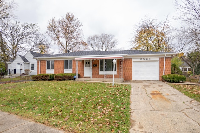 single story home featuring a garage and a front lawn