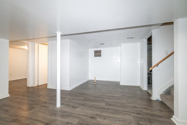 basement featuring dark hardwood / wood-style floors